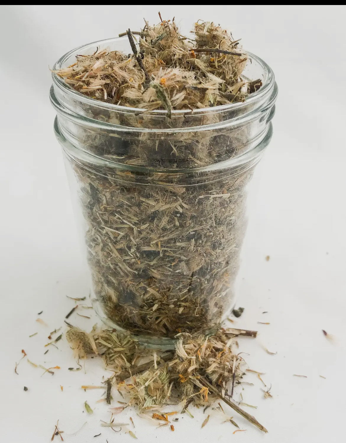 Dried Herbs Chamomile elderberry dandelion, Mint, peppermint, hibiscus in small jars for flavorful culinary creations.