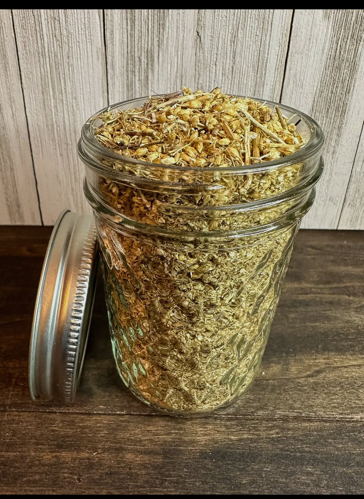 Dried Herbs Chamomile elderberry dandelion, Mint, peppermint, hibiscus in Small Jars for fresh culinary flavor.